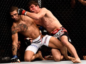 Darren Elkins of the United States punches Lucas Martins of Brazil in their featherweight bout during the UFC 179 event at Maracanazinho on October 25, 2014 in Rio de Janeiro, Brazil. (Photo by Buda Mendes/Getty Images)