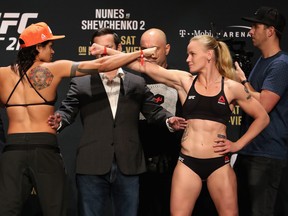 Opponents Amanda Nunes (left) of Brazil and Valentina Shevchenko of Kyrgyzstan face off during the UFC weigh-in at the Park Theater on July 7, 2017 in Las Vegas, Nevada. The rescheduled match is in Edmonton this weekend.