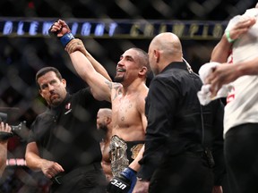 LAS VEGAS, NV - JULY 9: Robert Whittaker celebrates after his victory over Yoel Romero of Cuba in their interim UFC middleweight championship bout during the UFC 213 event at T-Mobile Arena on July 9, 2017 in Las Vegas, Nevada. (Photo by Rey Del Rio/Getty Images)