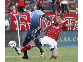 Bernie Ibini of the Vancouver Whitecaps battles for ball posession with FC Dallas's during Saturday's MLS game in Frisco, Texas. The Caps won 4-0.