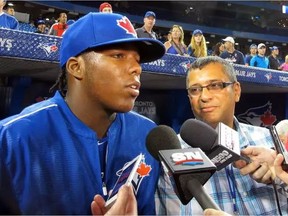 Vladimir Guerrero Jr. speaks to the media after taking batting practice with the Toronto Blue Jays in July 2015. Photo by John Lott for the National Post