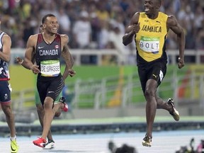 Canada&#039;s Andre De Grasse (left) and Jamaica&#039;s Usain Bolt share a laugh before they cross the finish line as they set the two fastest times in the 200-metre semifinals at the Olympic games in Rio de Janeiro, Brazil, Wednesday August 17, 2016. De Grasse will be in the spotlight starting Friday at London Olympic Stadium, when he races Usain Bolt for the final time at the world championships. THE CANADIAN PRESS/Frank Gunn