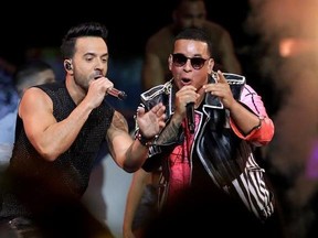 FILE - In this April 27, 2017 file photo, singers Luis Fonsi, left and Daddy Yankee perform during the Latin Billboard Awards in Coral Gables, Fla. On Friday, Aug. 4, 2017, YouTube announced that the music video for the No. 1 hit song ‚ÄúDespacito‚Äù has become the most viewed clip on YouTube of all-time. (AP Photo/Lynne Sladky, File)