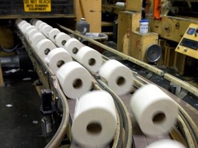 Rolls of toilet paper speed down a conveyor belt towards the packaging department in the Potlatch plant, Sept. 30, 2003 in Lewiston, Idaho. A New Brunswick seniors&#039; home is advising residents they will each be limited to two rolls of toilet paper a week. THE CANADIAN PRESS/AP/Jeff T. Green
