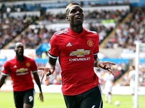 Manchester United&#039;s Paul Pogba celebrates scoring his side&#039;s third goal, during the English Premier League soccer match between Swansea and Manchester United, at the Liberty Stadium, in Swansea, Wales, Saturday Aug. 19, 2017. (Nick Potts/ PA via AP)