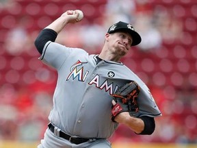 Miami Marlins starting pitcher throws against the Cincinnati Reds during the first inning of a baseball game, Sunday, July 23, 2017, in Cincinnati. The Toronto Blue Jays acquired right-handed pitcher Tom Koehler and cash from the Miami Marlins on Saturday night for minor league pitcher Osman Gutierrez. THE CANADIAN PRESS/AP, Gary Landers