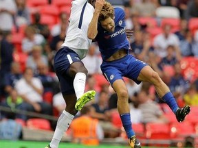 Chelsea&#039;s Marcos Alonso, right, vies for the ball with Tottenham Hotspur&#039;s Victor Wanyama during their English Premier League soccer match between Tottenham Hotspur and Chelsea at Wembley stadium in London, Sunday, Aug. 20, 2017.Chelsea won the game 2-1. (AP Photo/Alastair Grant)