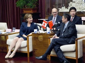 Christy Clark, then B.C. premier, talks with Xu Niansha, chairman of China Poly Group, in November 2015.