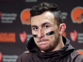 In this Dec. 20, 2015, file photo, Cleveland Browns quarterback Johnny Manziel speaks with media members following the team&#039;s 30-13 loss to the Seattle Seahawks in an NFL football game in Seattle. The Hamilton Tiger-Cats have worked out Manziel but aren&#039;t close to signing the former Heisman Trophy winner. THE CANADIAN PRESS/AP/Scott Eklund,