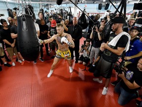 UFC lightweight champion Conor McGregor hits a heavy bag during a media workout at the UFC Performance Institute last week in Las Vegas, Nevada. McGregor will fight Floyd Mayweather Jr. in a boxing match at T-Mobile Arena on Aug. 26 in Las Vegas.