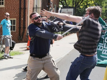 CHARLOTTESVILLE, VA - AUGUST 12:  White nationalists, neo-Nazis and members of the "alt-right" clash with counter-protesters in the street after the "Unite the Right" rally was delcared a unlawful gathering by Virginia State Police August 12, 2017 in Charlottesville, Virginia. After clashes with anti-fascist protesters and police the rally was declared an unlawful gathering and people were forced out of Lee Park, where a statue of Confederate General Robert E. Lee is slated to be removed.
