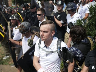 CHARLOTTESVILLE, VA - AUGUST 12:  White nationalists, neo-Nazis and members of the "alt-right" exchange insluts with counter-protesters as they attempt to guard the entrance to Lee Park during the "Unite the Right" rally August 12, 2017 in Charlottesville, Virginia. After clashes with anti-fascist protesters and police the rally was declared an unlawful gathering and people were forced out of Lee Park, where a statue of Confederate General Robert E. Lee is slated to be removed.