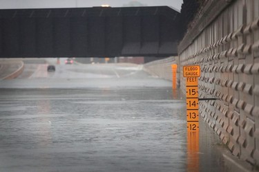 A guage shows the depth of water a an underpass on Interstate 10 which has been inundated with flooding from Hurricane Harvey on August 27, 2017 in Houston, Texas.