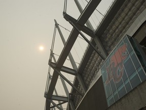 Wildfire smoke obscures the sun over BC Place on Friday afternoon.