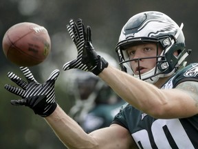 Philadelphia Eagles' Adam Zaruba catches a pass during NFL football training camp in Philadelphia, Friday, July 28, 2017. Zaruba has travelled the world with the Canadian rugby sevens team. On Thursday, he'll likely mark another tick on his bucket list by playing in Lambeau Field.It's the first NFL exhibition game for the six-foot-five 265-pounder from North Vancouver, who is looking to catch on with the Philadelphia Eagles.