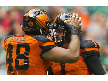 BC Lions #48 Maxx Forde bumps helmets with #1 Ty Long after a successful field goal against the Saskatchewan Roughriders  in a regular season CHL football game at BC Place Vancouver, August 05 2017.