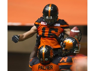 BC Lions #68 Kevin Palmer lifts #16 Bryan Burnham after a touchdown against the Saskatchewan Roughriders in a regular season CHL football game at BC Place Vancouver, August 05 2017.