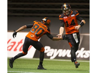 BC Lions #80 Brett Blaszko low fives #14 Travis Lulay after a two point conversion against the Saskatchewan Roughriders in a regular season CHL football game at BC Place Vancouver, August 05 2017.