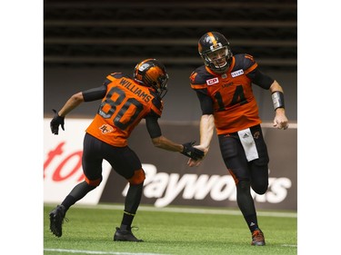 BC Lions #80 Brett Blaszko low fives #14 Travis Lulay after a two point conversion against the Saskatchewan Roughriders in a regular season CHL football game at BC Place Vancouver, August 05 2017.