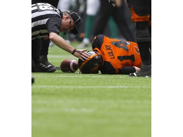 An official checks on BC Lions #14 Travis Lulay after he was sacked by the Saskatchewan Roughriders in a regular season CHL football game at BC Place Vancouver, August 05 2017.