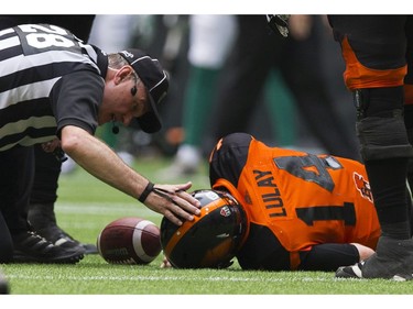 An official checks on BC Lions #14 Travis Lulay after he was sacked by the Saskatchewan Roughriders in a regular season CHL football game at BC Place Vancouver, August 05 2017.