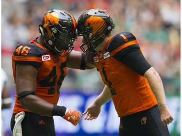BC Lions #46 Rolly Lumbala bumps helmets with #1 Ty Long after a successful field goal against the Saskatchewan Roughriders  in a regular season CHL football game at BC Place Vancouver, August 05 2017.