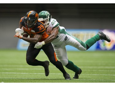 BC Lions #39 Chandler Fenner  is tackled by a Saskatchewan Roughriders after making an interception in a regular season CHL football game at BC Place Vancouver, August 05 2017.