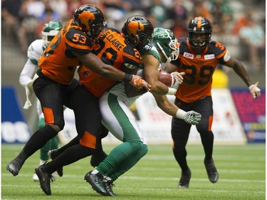 Saskatchewan Roughriders #9 Nic Demski is swarmed by BC Lions #29 Steven Clark, #39 Chandler Fenner and #53 Jordan Herdman in a regular season CHL football game at BC Place Vancouver, August 05 2017.