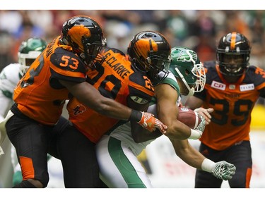 Saskatchewan Roughriders #9 Nic Demski is swarmed by BC Lions #29 Steven Clark, #39 Chandler Fenner and #53 Jordan Herdman in a regular season CHL football game at BC Place Vancouver, August 05 2017.