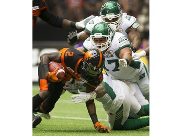 BC Lions #2 Chris Rainey is covered by a trio of Saskatchewan Roughriders players in a regular season CHL football game at BC Place Vancouver, August 05 2017.