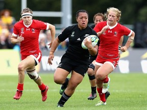 Toka Natua of New Zealand Black Ferns runs the ball against Canada at the Women's Rugby World Cup in Dublin.