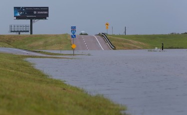 Rains floods the Interstate 45 feeder road between Galveston and La Marque after a stormy night on Sunday, Aug. 27, 2017 in La Marque, Texas.