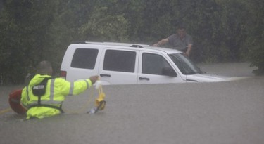 Wilford Marintez, Richard Wagner

Wilford Martinez, right, waits to be rescued by Harris County Sheriff's Department Richard Wagner after his car got stuck in floodwaters from Tropical Storm Harvey on Sunday, Aug. 27, 2017, in Houston, Texas. (AP Photo/David J. Phillip) ORG XMIT: TXDP112
David J. Phillip, AP