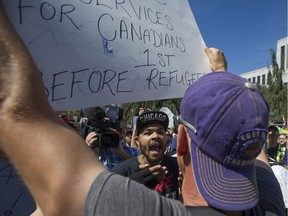 Thousands surrounded Vancouver City Hall on Aug. 19 to attend a counter march in protest of a planned anti-Muslim rally that was to take place at city hall Saturday afternoon. Several scuffles took place, but were dealt with by police.
