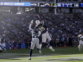 Los Angeles Chargers tight end Antonio Gates (85) scores a touchdown as Seattle Seahawks defensive back Shaquill Griffin (26) defends during the first half of an NFL football game Sunday, Aug. 13, 2017, in Carson, Calif. (AP Photo/Jae C. Hong)