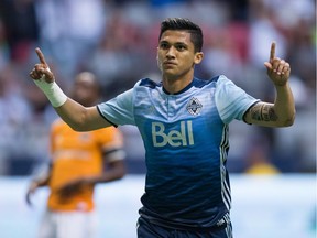 Whitecaps' Fredy Montero celebrates after scoring on a penalty kick to open scoring in Vancouver's 2-1 win over the Houston Dynamo in August at B.C. Place Stadium.