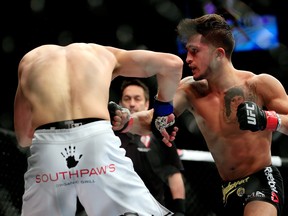 LAS VEGAS, NV - DECEMBER 06:  Sergio Pettis lands a punch against Matt Hobar in their fight during the UFC 181 event at the Mandalay Bay Events Center on December 6, 2014 in Las Vegas, Nevada.  (Photo by Alex Trautwig/Getty Images)