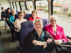 Angie (front, left) aboard the “seniors’ party bus”, part of the United Way funded program Let’s Walk and Roll which takes seniors on semi-monthly outings and includes door-to-door service plus lunch and dinner.