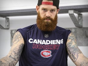 Canadiens' Jordie Benn shows off some of his tattoos after training camp session at the Bell Sports Complex in Brossard on Friday, Sept. 22, 2017.