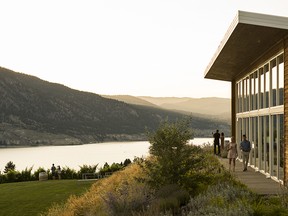 A young couple samples wine at Poplar Grove winery in Penticton, BC.