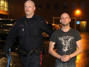 Allan Shyback is taken into custody in Calgary on December 6, 2014, charged with second murder