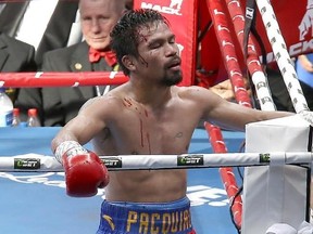 FILE - In this July 23, 2017, file photo, Manny Pacquiao, of the Philippines, reacts after his loss to Jeff Horn, of Australia, in a WBO World Welterweight title fight in Brisbane, Australia. Pacquiao won&#039;t box Horn in a rematch of their WBO world welterweight title fight this year because the Filipino senator will be busy with government duties. Pacquiao&#039;s unavailability for a proposed Nov. 12 bout was announced Friday, Sept. 1, 2017, by Australian promoters of the fight. (AP Photo/Tertius Pick