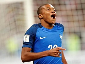 France&#039;s Kylian Mbappe reacts after scoring France&#039; s fourth goal during the World Cup Group A qualifying soccer match between France and The Netherlands at the Stade de France stadium in Saint-Denis, outside Paris, Thursday, Aug.31, 2017. (AP Photo/Christophe Ena)
