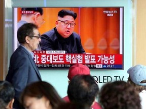 People watch a TV news program showing North Korean leader Kim Jong Un at the Seoul Railway Station in Seoul, Sunday, Sept. 3, 2017. North Korea said it set off a hydrogen bomb Sunday in its sixth nuclear test, which judging by the earthquake it set off appeared to be its most powerful explosion yet. The signs read &ampquot;North Korea, important announcement.&ampquot; (AP Photo/Ahn Young-joon)