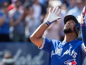 Toronto Blue Jays Teoscar Hernandez gestures as he approaches home plate after hitting a three-run homer off Detroit Tigers pitcher Anibal Sanchez during fifth inning Major League baseball action in Toronto on Sunday, September 10, 2017. THE CANADIAN PRESS/Chris Young