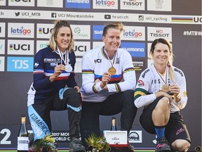 Miranda Miller of Canada (1st), Myriam Nicole of France (2nd) and Tracey Hannah of Australia (3rd) celebrate on the podium for the Elite Womens Downhill race during the 2017 Mountain Bike World Championships on September 10, 2017 in Cairns, Australia.