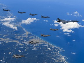 This US Army handout photo obtained September 23, 2017 shows Air Force and Marine Corps aircraft conducting a mission with the South Korean air force over the Korean Peninsula, on September 18, 2017.