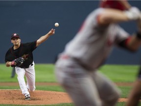 Vancouver Canadians  starting pitcher Zach Logue pitches to the Spokane Indians in game 2 of the single-A baseball Northwest League North Division finals at Nat Bailey Stadium on Thursday, Sept. 7.
