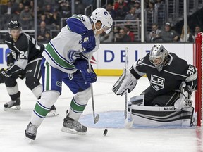 Vancouver Canucks forward Bo Horvat (53) and Los Angeles Kings goalie Darcy Kuemper battle in the third period of an NHL preseason hockey game in Los Angeles Saturday, Sept. 16, 2017. The Canucks won in overtime, 4-3. (AP Photo/Reed Saxon) ORG XMIT: LAS610
Reed Saxon, AP