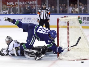 The Vancouver Canucks' Sam Gagner misses his attempt against Los Angeles Kings goalie Darcy Kuemper during a shootout in their NHL China exhibition game at the Cadillac Arena in Beijing, Saturday, Sept. 23, 2017. The Kings won 4-3 in an overtime shootout.